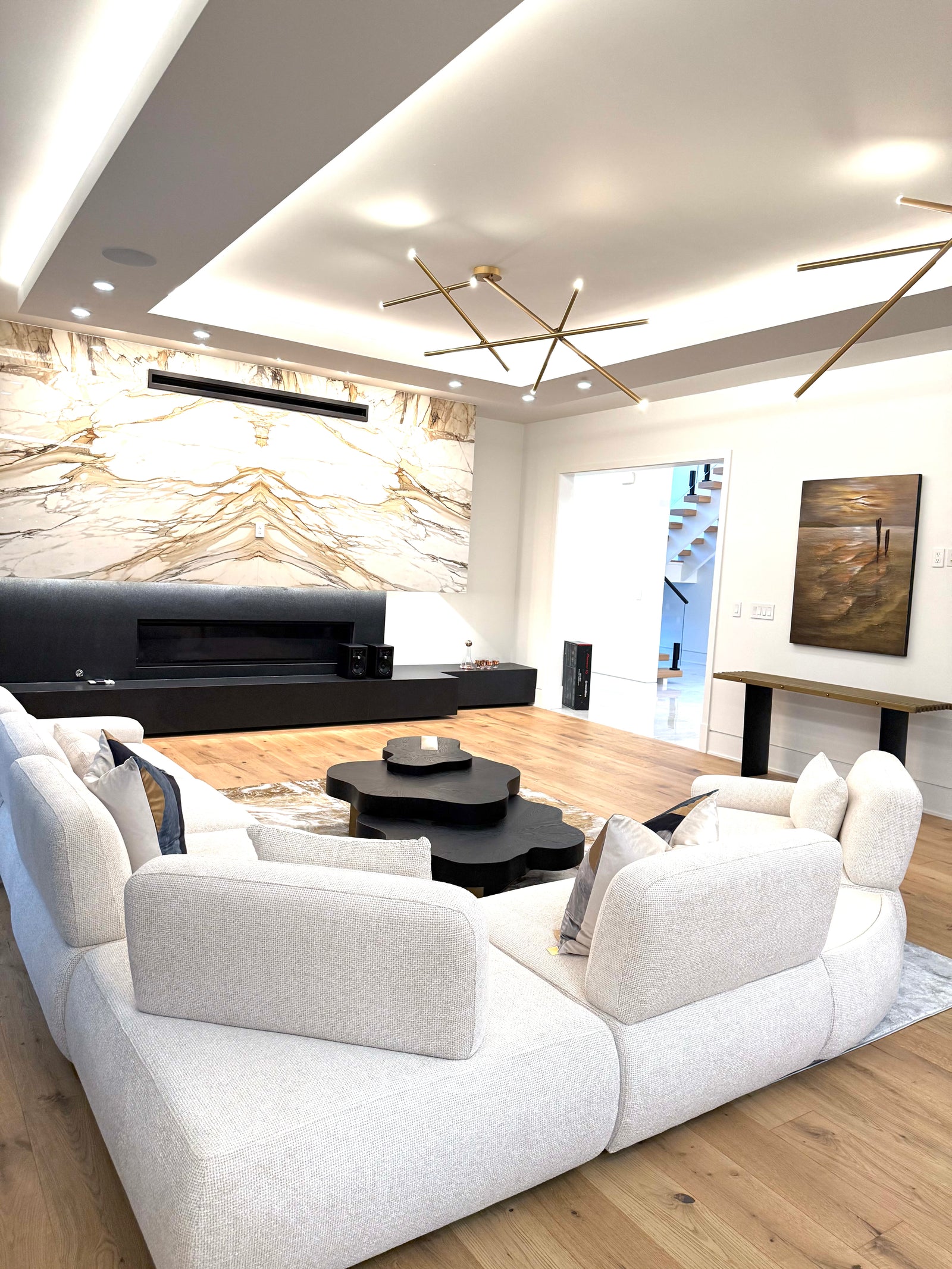 Contemporary Retreat in McLean living room in McLean Virginia featuring the Astor 5-Piece Modular Sectional and Eichholtz Vauclair Console Table