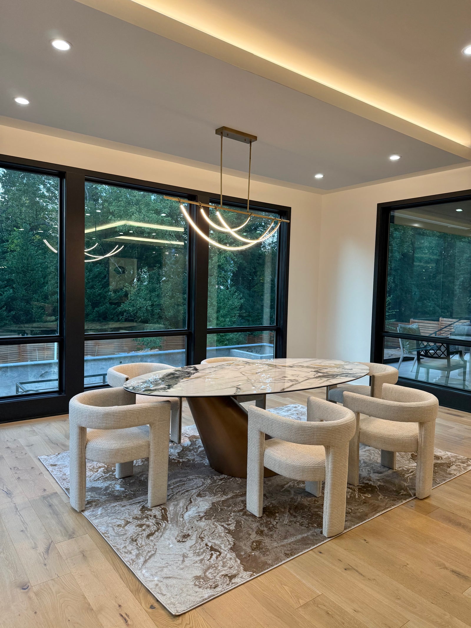 Contemporary Retreat in McLean living room in McLean Virginia featuring the Verve Sculpted Dining Chair and Berryville Oval Dining Table